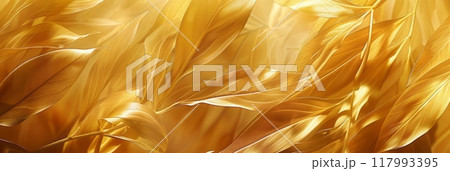 Tropical gold leaves exhibit silky textures against a gold background, highlighting their opulent sheen and intricate detailing in natural beauty, banner Tropical gold leaves exhibit silky textures against a gold background, highlighting their opulent sheen and intricate detailing in natural beauty, banner 117993395