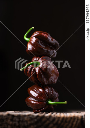 Tower from ripened chocolate habanero peppers Tower from ripened chocolate habanero peppers 117994268
