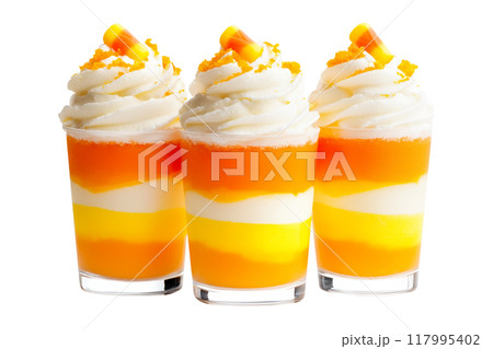 Candy corn parfait desserts topped with whipped cream and candy corn pieces isolated on white transparent background. Concept of festive Halloween treats 117995402