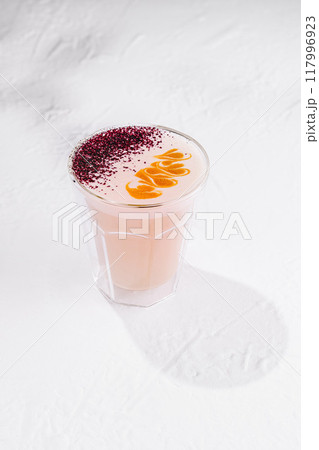 Pink moon milk beverage standing on white background casting shadow Pink moon milk beverage standing on white background casting shadow 117996923