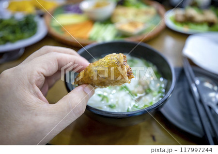 A table full of delicious Vietnamese Banh Xeo. A table full of delicious Vietnamese Banh Xeo. 117997244
