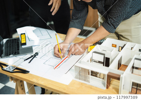 Architect or construction engineer caucasian plan on hard project at work,  industry professional team. 117997389