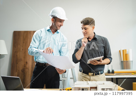 Architect or construction engineer caucasian plan on hard project at work, industry professional team. Architect or construction engineer caucasian plan on hard project at work, industry professional team. 117997395