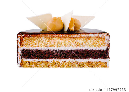 Delicious chocolate cake with caramel and white chocolate decoration 117997938