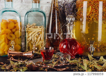 Bartender preparing a delicious cocktail with homemade alcohol infusions Bartender preparing a delicious cocktail with homemade alcohol infusions 117998059