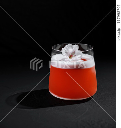 Elegant cocktail with blossom garnish Elegant cocktail with blossom garnish 117998705