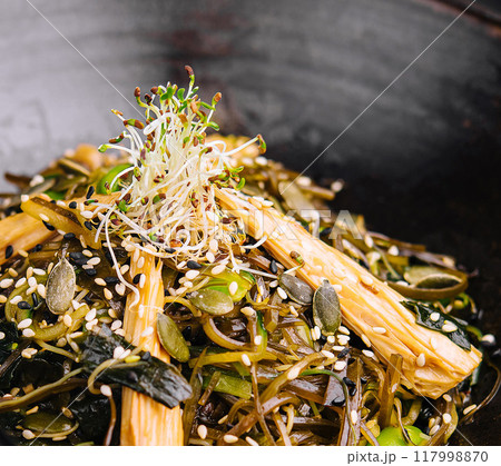 Vegan stir-fry noodles with sprouts and seeds Vegan stir-fry noodles with sprouts and seeds 117998870