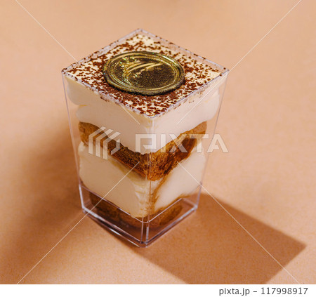 Elegant tiramisu dessert in glass cup Elegant tiramisu dessert in glass cup 117998917