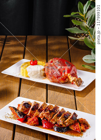 Gourmet grilled meat assortment on wooden table Gourmet grilled meat assortment on wooden table 117999101