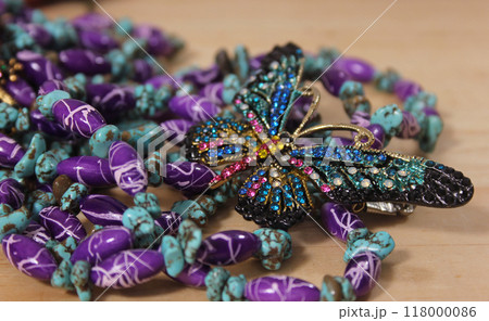 Southwestern Style Jewelry on Wooden Table With Rustic Decor 118000086