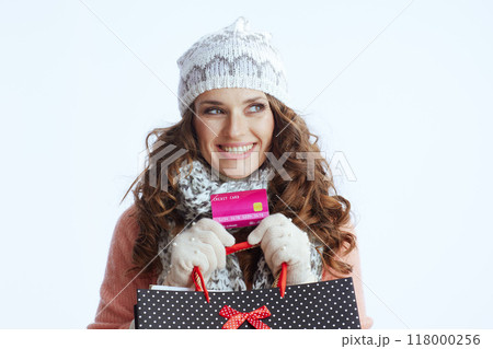 pensive trendy woman in sweater, mittens, hat and scarf pensive trendy woman in sweater, mittens, hat and scarf 118000256