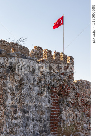 Turkish flag is on top of the fortress of Alanya Kale Turkish flag is on top of the fortress of Alanya Kale 118000609