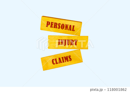 Words PERSONAL INJURY CLAIMS on wooden blocks, conceptual phrase, text 118001862