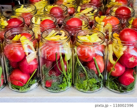 Glass jars with tomatoes for preservation. Canning vegetables at home. Organic products 118002396
