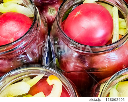 Glass jars with tomatoes for preservation. Canning vegetables at home. Organic products 118002403