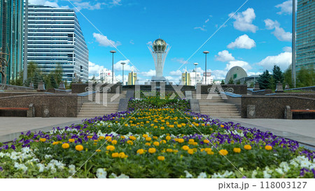 Flowers on Nurzhol Boulevard with Baiterek on background timelapse hyperlapse 118003127