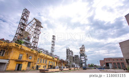 The construction of a large ship on a shipyard with cranes timelapse. 118003155