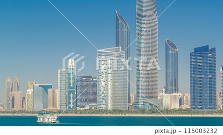 View of high skyscrapers on a corniche in Abu Dhabi stretching alongside the business center timelapse hyperlapse. View of high skyscrapers on a corniche in Abu Dhabi stretching alongside the business center timelapse hyperlapse. 118003232