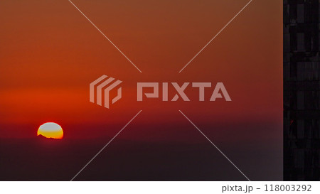 Sunrise close up view over Dubai skyline in the morning, aerial top view from downtown timelapse. Sunrise close up view over Dubai skyline in the morning, aerial top view from downtown timelapse. 118003292