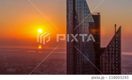Sunrise over Dubai skyline in the morning, aerial top view to downtown city center landmarks timelapse. 118003293