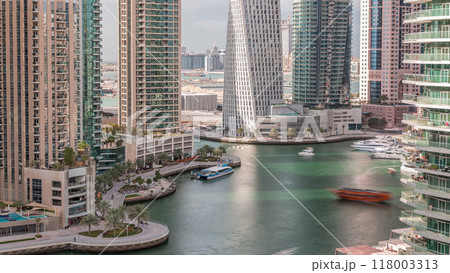 Aerial view of Dubai Marina residential and office skyscrapers with waterfront timelapse Aerial view of Dubai Marina residential and office skyscrapers with waterfront timelapse 118003313