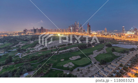 Dubai Marina skyscrapers and golf course night to day timelapse, Dubai, United Arab Emirates 118003325