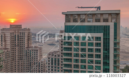 Sunrise over towers in Greens district aerial view from top timelapse. 118003327