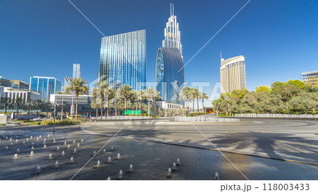 Fountains near main entrance to the tallest skyscraper timelapse hyperlapse, Dubai 118003433