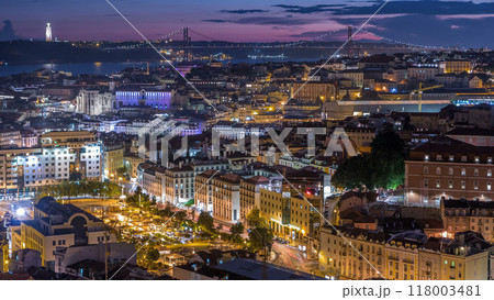 Lisbon after sunset aerial panorama view of city centre with red roofs at Autumn day to night timelapse, Portugal Lisbon after sunset aerial panorama view of city centre with red roofs at Autumn day to night timelapse, Portugal 118003481
