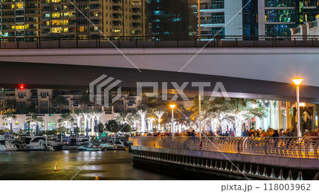 Promenade in Dubai Marina timelapse at night, UAE. Promenade in Dubai Marina timelapse at night, UAE. 118003962