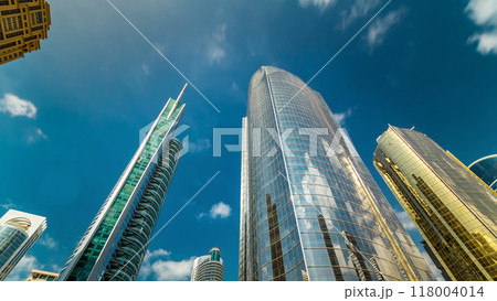 Look up panoramic and perspective view to steel glass high rise building skyscrapers timelapse hyperlapse, Dubai, UAE Look up panoramic and perspective view to steel glass high rise building skyscrapers timelapse hyperlapse, Dubai, UAE 118004014