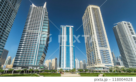 Residential buildings in Jumeirah Lake Towers timelapse hyperlapse in Dubai, UAE. 118004028
