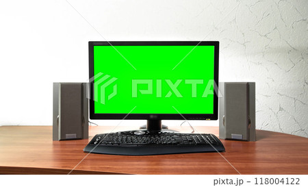 Computer green screen monitor is standing on a desk in an office timelapse hyperlapse. 118004122