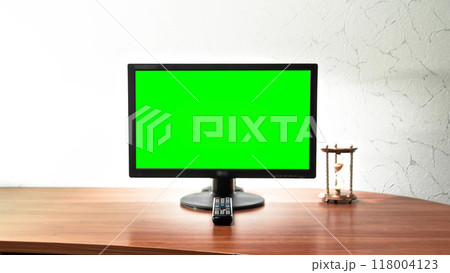 Computer green screen monitor is standing on a desk in an office timelapse hyperlapse. 118004123