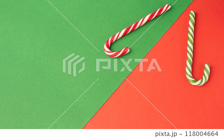 green and red candy canes on paper background 118004664