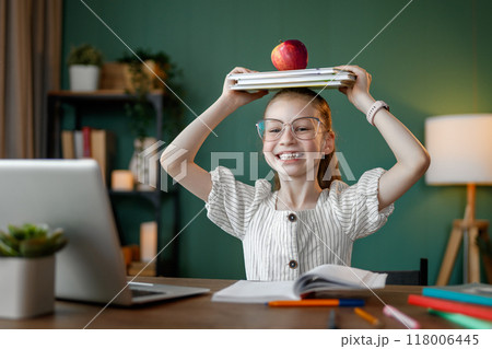 Girl doing homework 118006445