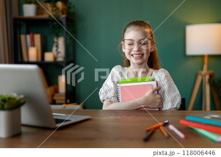 Girl doing homework 118006446