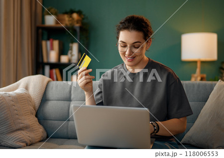 Woman is doing online purchases Woman is doing online purchases 118006553