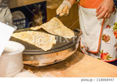 Freshly baked Turkish Gozleme, flatbread with greens and cheese. 118008447