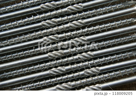 Close-up of long screws. Screws for the construction of wooden structures. 118009205