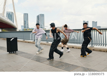 Dancing Group Performing Hip-Hop Routine Outdoors 118009373