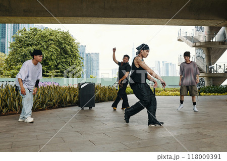 Dancing Outdoors in Urban Setting with Graffiti Background 118009391