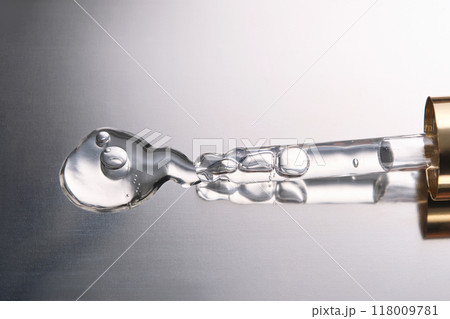 Pipette with cosmetic gel or serum close-up. Pipette with cosmetic gel or serum close-up. 118009781