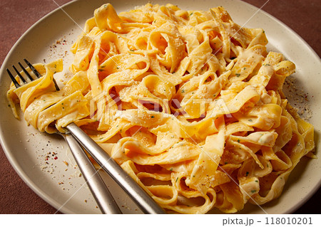 Fettuccine, tagliatelle, in creamy garlic sauce, Italian traditional cuisine, pasta carbonaro, Fettuccine, tagliatelle, in creamy garlic sauce, Italian traditional cuisine, pasta carbonaro, 118010201