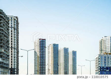 New apartment building of modern architecture. Modern residential quarter of the city. Development, construction, housing concept. New apartment building of modern architecture. Modern residential quarter of the city. Development, construction, housing concept. 118010575