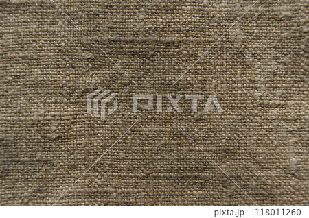 Natural linen fabric. Beige linen background, fabric texture for fashion design or upholstered furniture 118011260