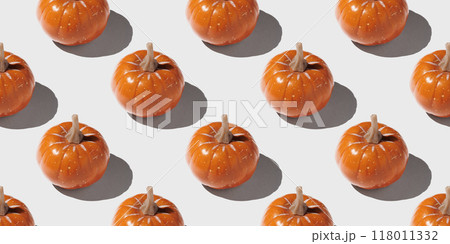 Orange pumpkin pattern on pastel color background Orange pumpkin pattern on pastel color background 118011332