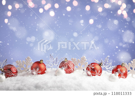 Christmas balls and snowflake with snow on color background 118011333