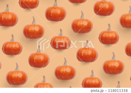 Orange pumpkin pattern on pastel color background 118011338