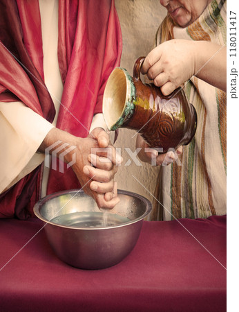 The servant pours water, and the master washes his hands The servant pours water, and the master washes his hands 118011417